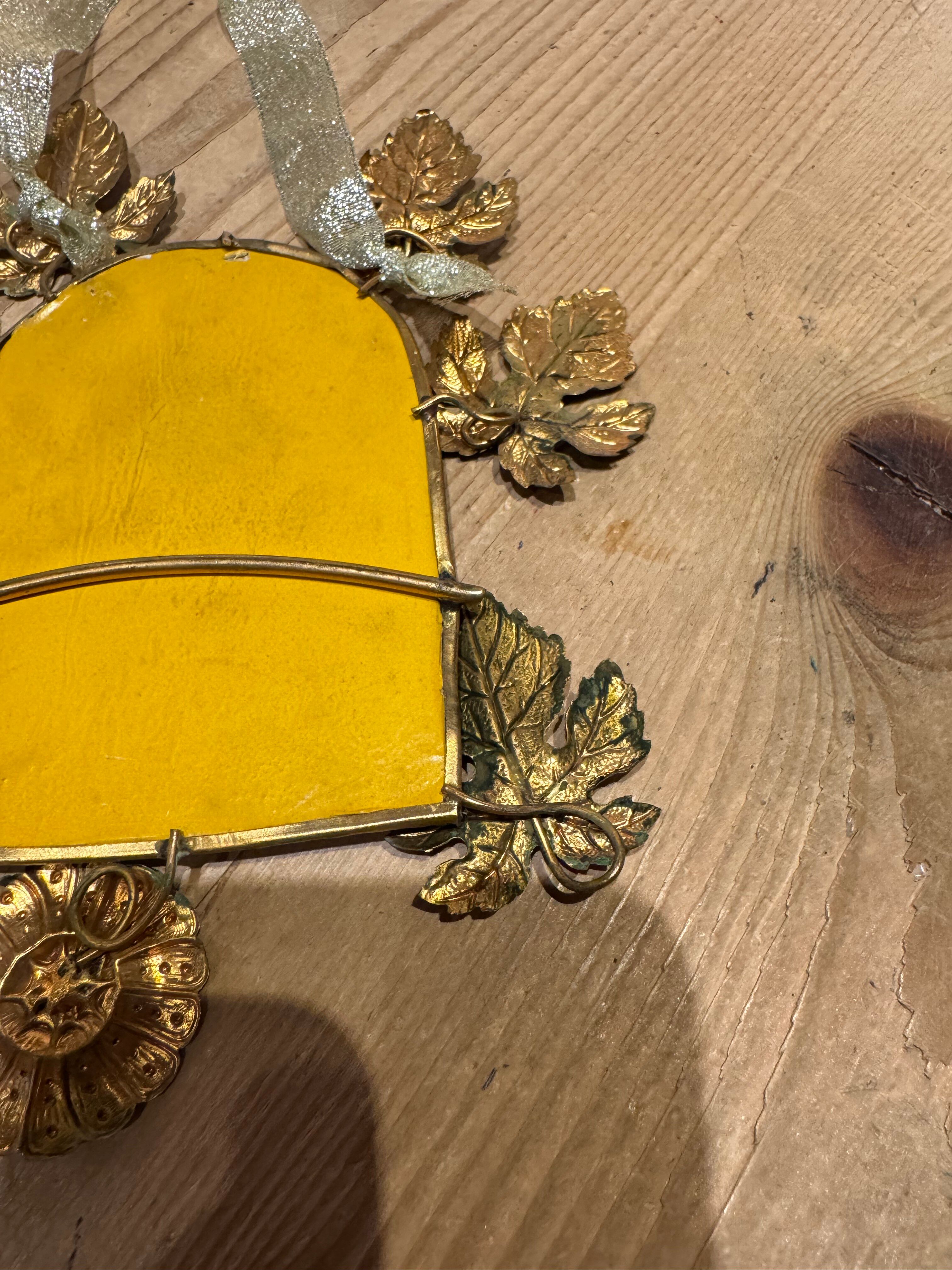 Ornamental brass mirror