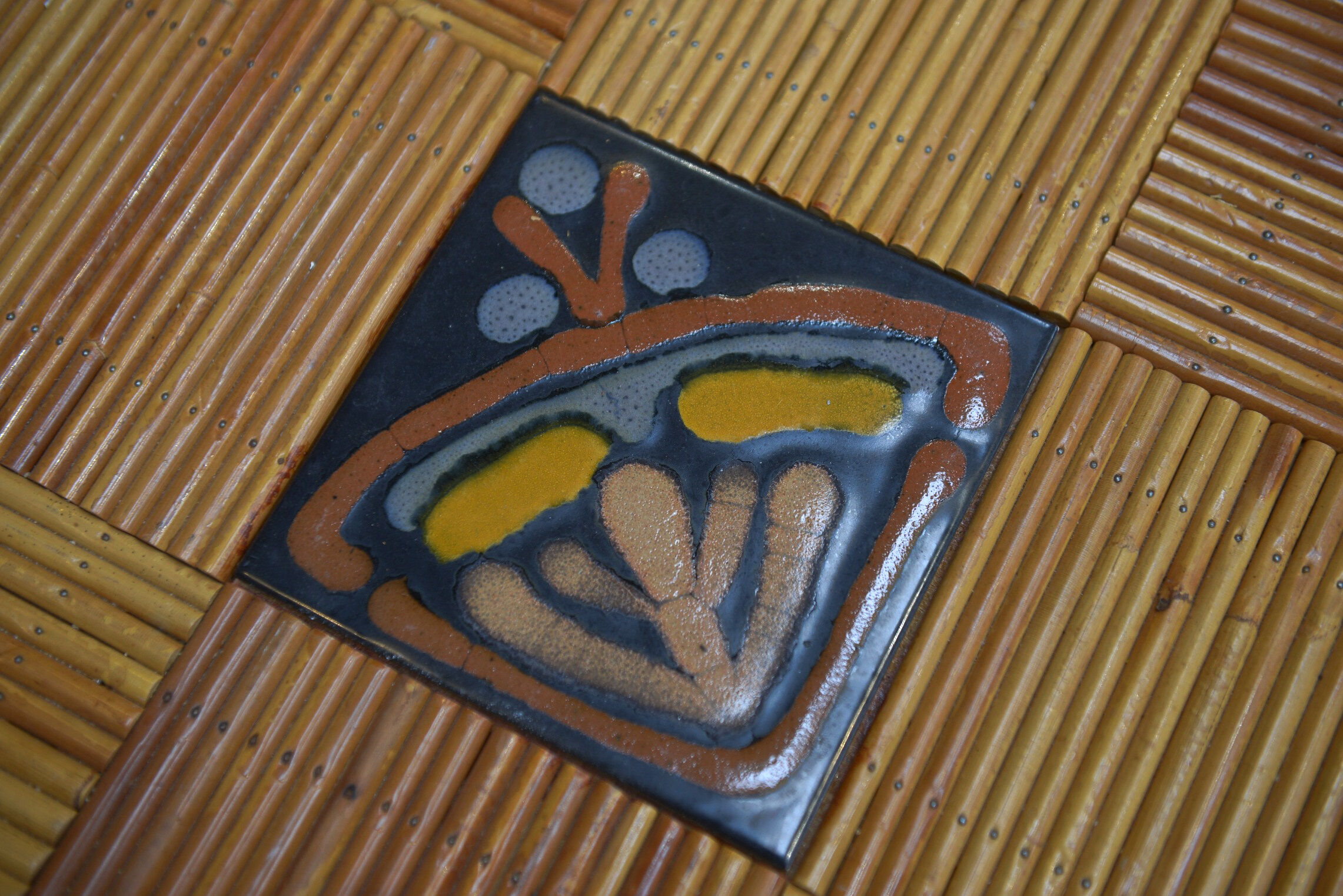 Rattan and ceramic table 1960