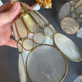 Pair of portable lamps with mother-of-pearl lampshades and brass.