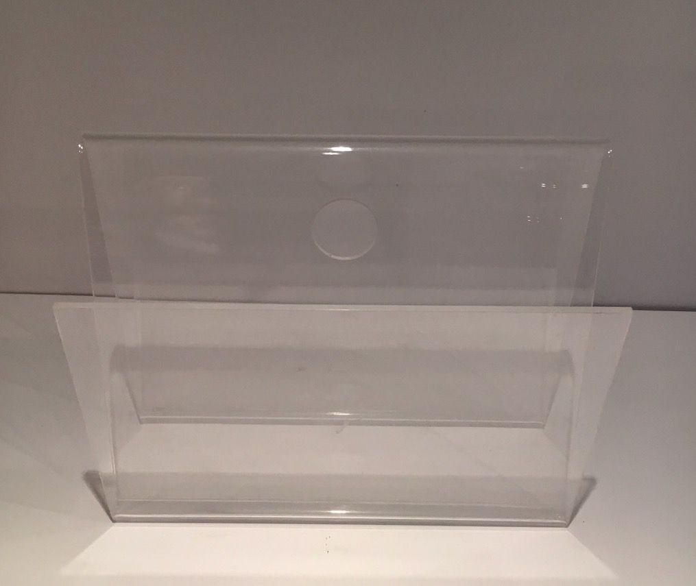 Acrylic magazine rack. Circa 1970.