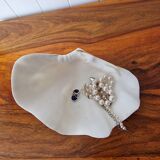 Shell holy water font emptier
