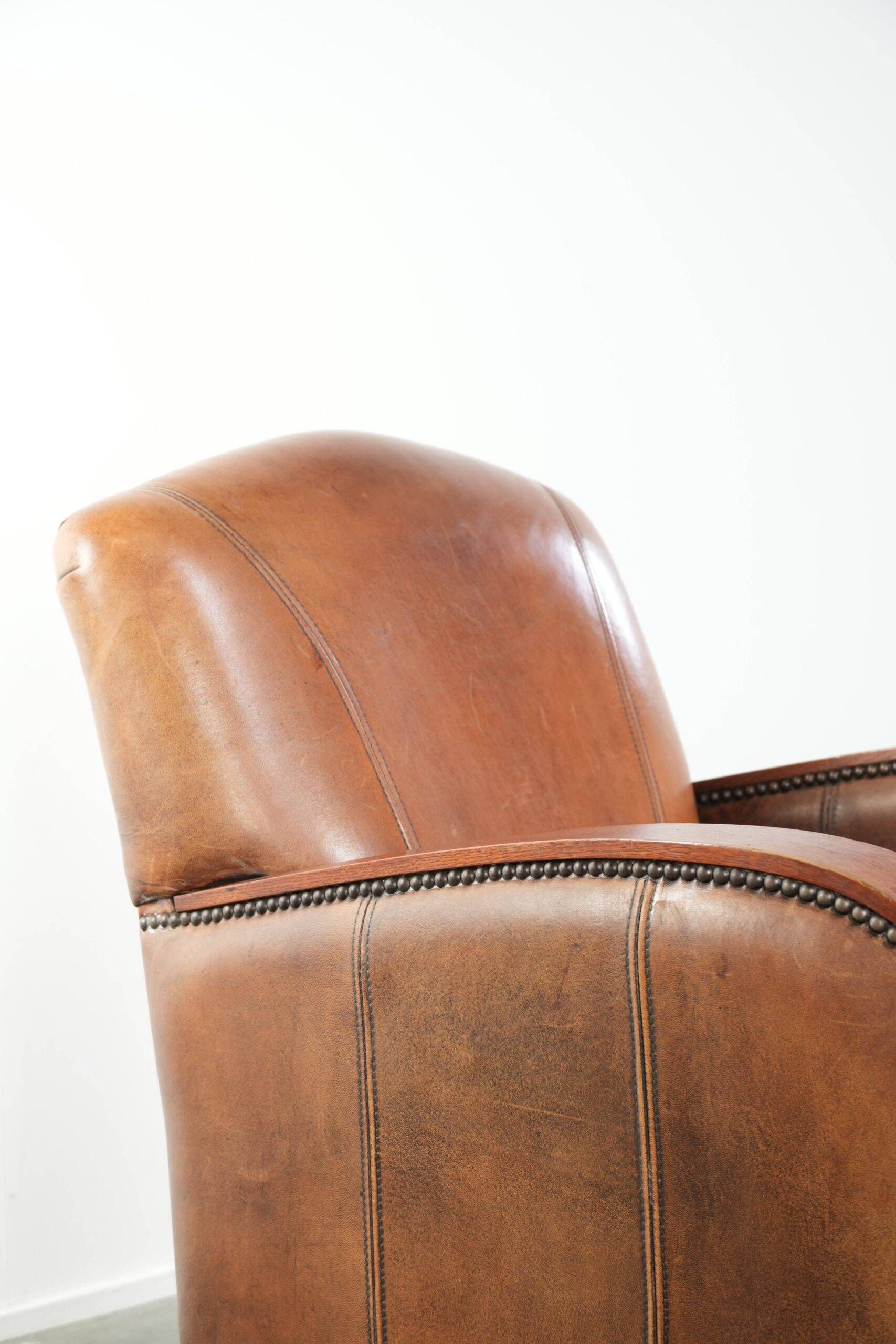 Sheepskin armchair in Art Deco style with wooden armrests