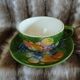 Antique cup and saucer in slipware.