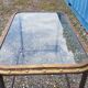 Table with an old ship porthole in brass and a metal base / 110 x 70 x 76 cm