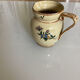 Old ceramic jug with floral decoration