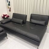 2 black leather sofas roche bobois scenario, one three-seater and one chaise longue.