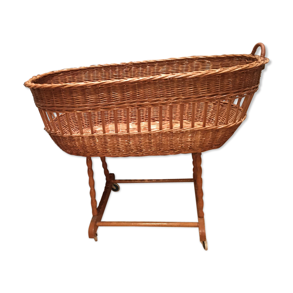 Vintage wicker baby cot on wheels