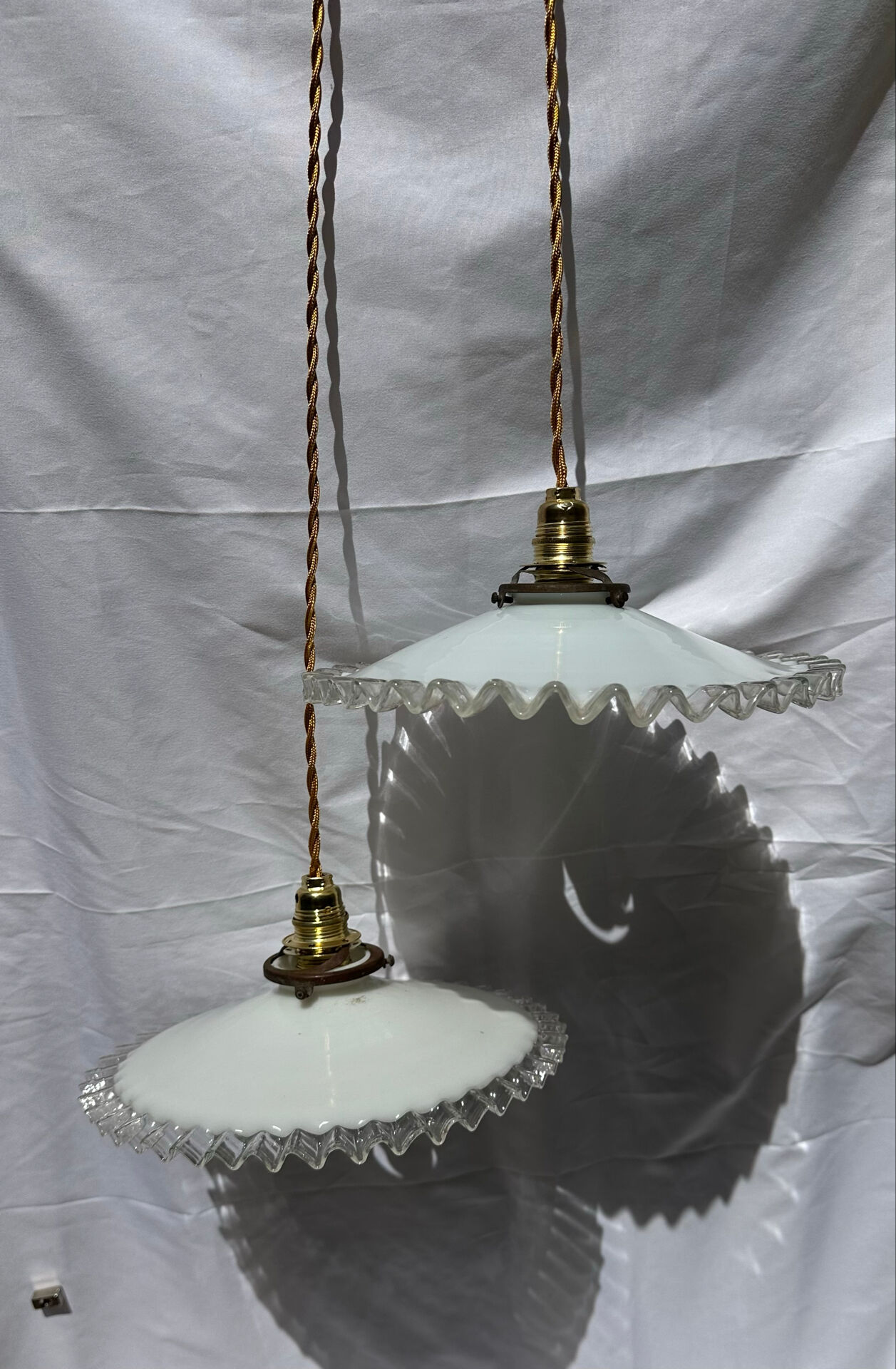 Vintage wavy opaline suspension pair with brass claw