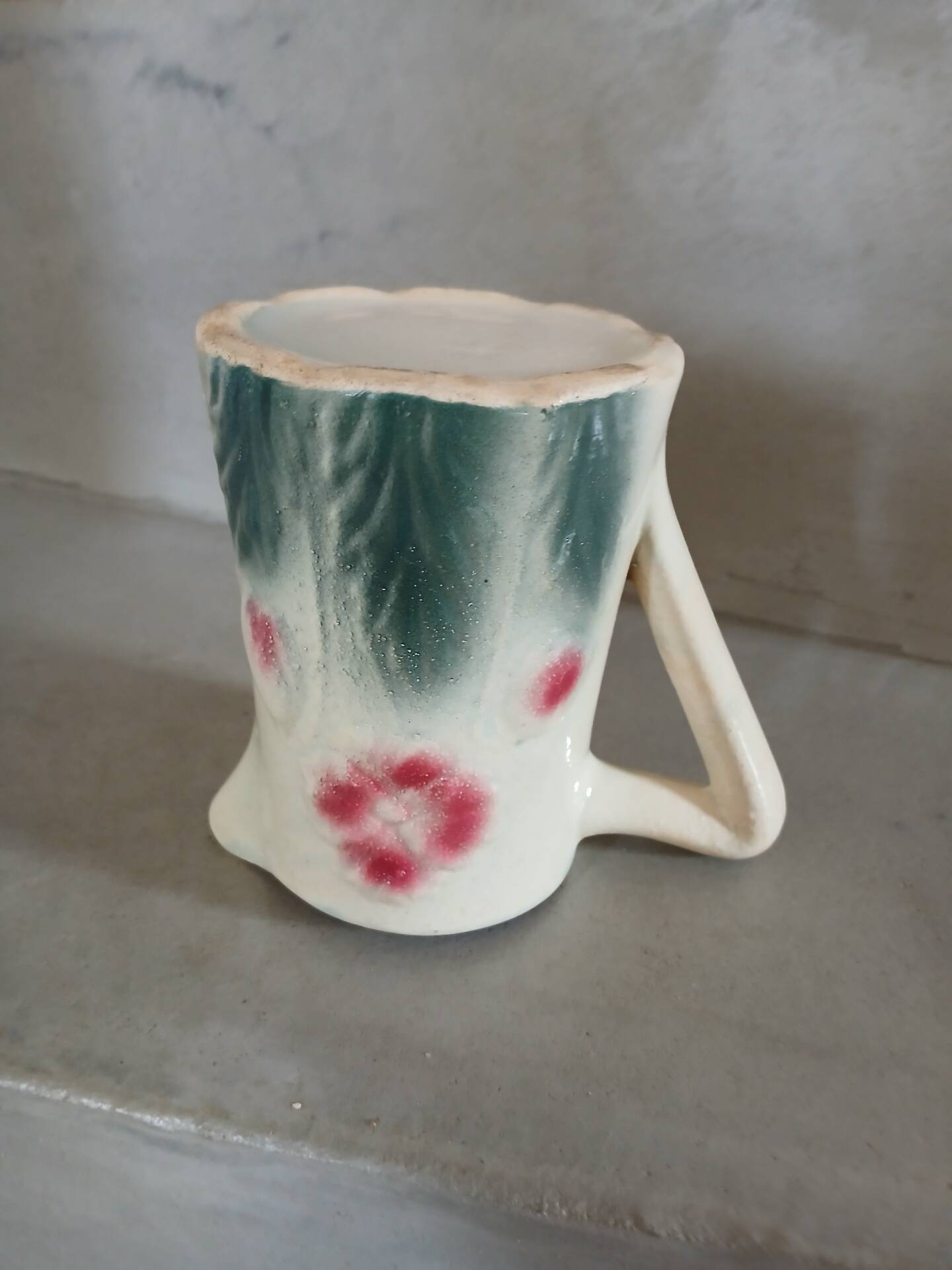 Small antique jug in slipware.
