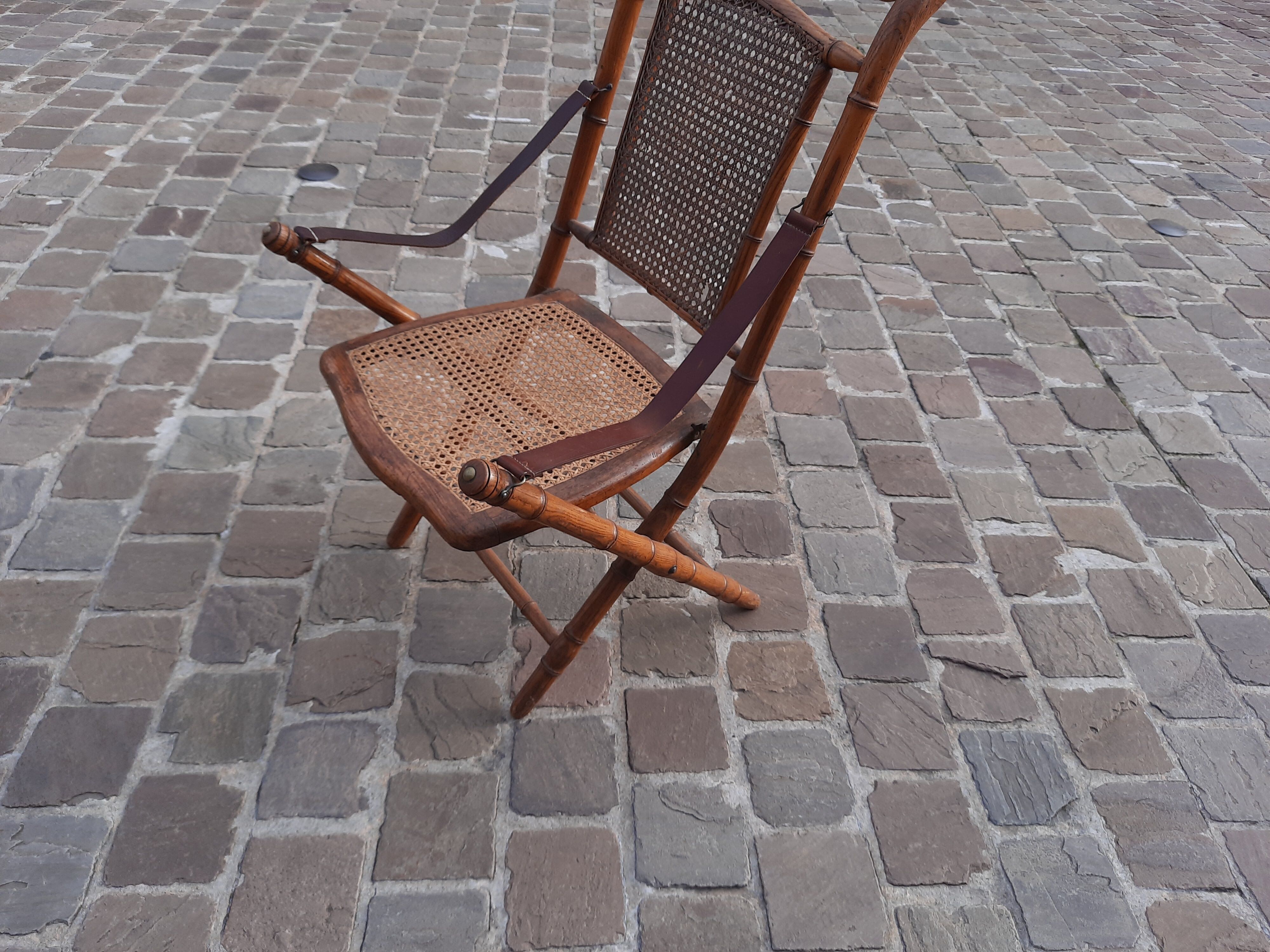 Bamboo folding chair and caning, leather and brass