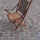 Bamboo folding chair and caning, leather and brass