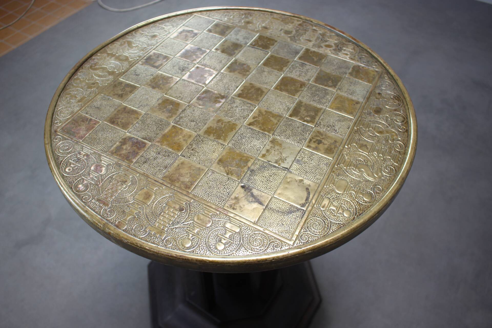 Art Deco chess table from the 1930s with a hand-decorated brass top and a stained oak base.