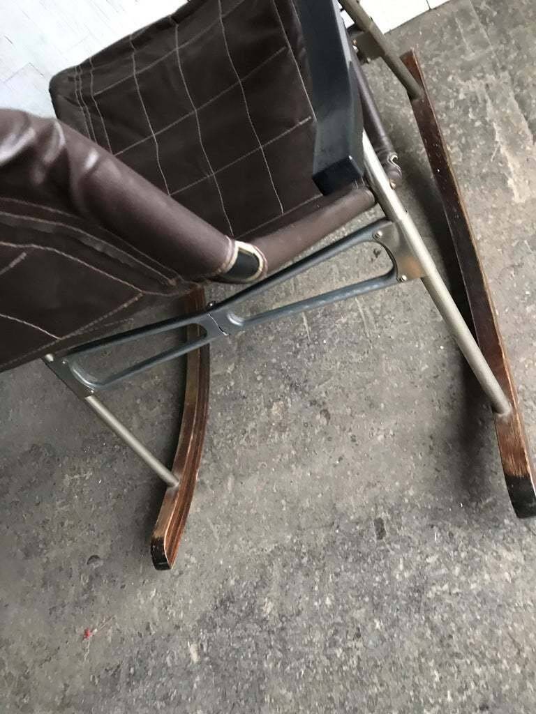 Mid-Century Japanese rocking chair in black leather, metal, and wood by Takeshi Nii (1950s)