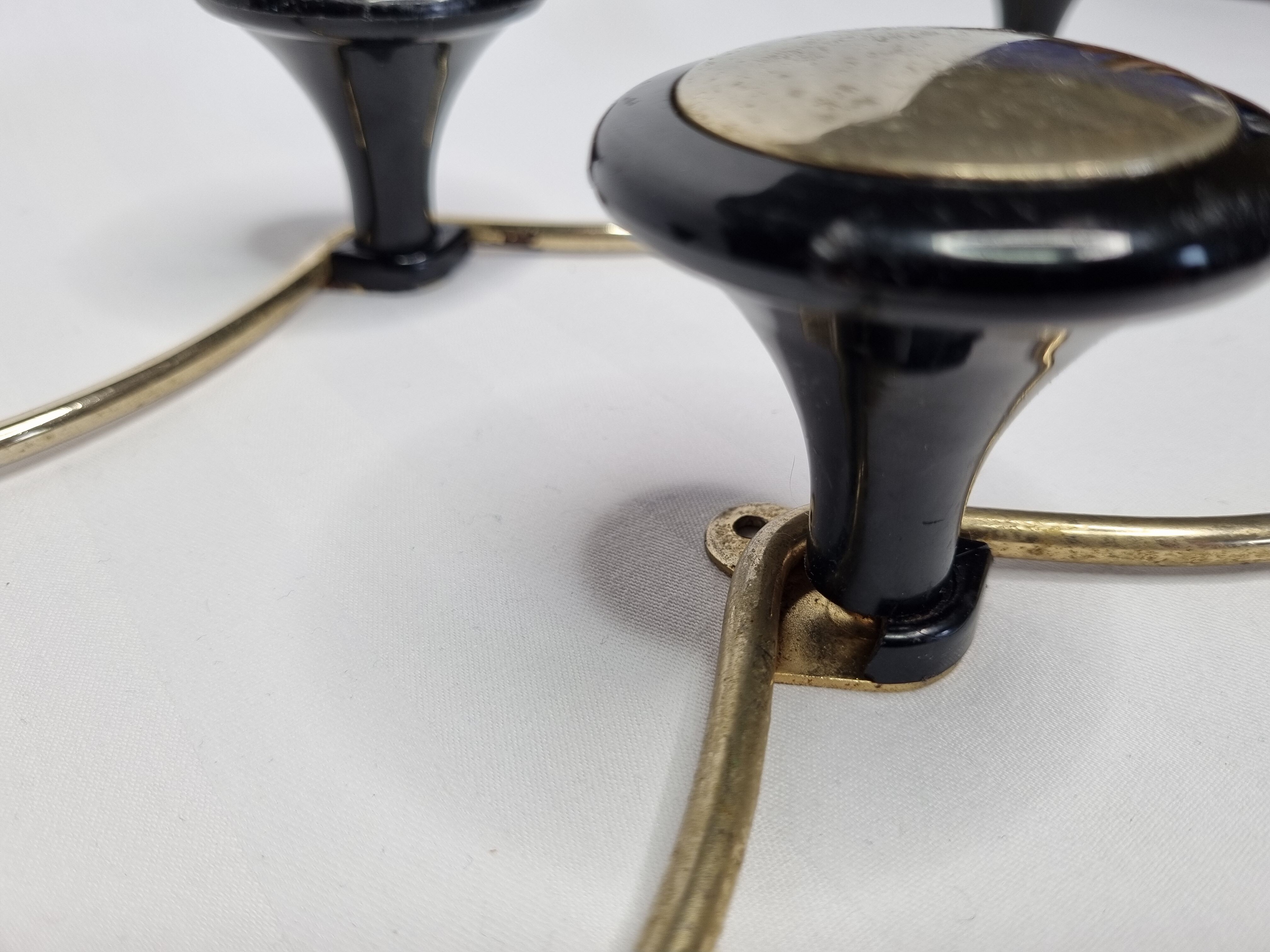 Pair of vintage wall coat racks in gold metal