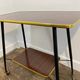Vintage side table, brass gallery and wheels, 1950s.