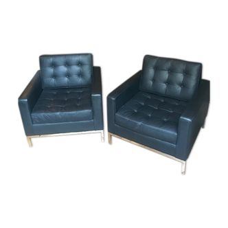 Pair of black leather armchairs