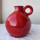 Red ceramic pitcher