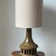 Vintage ceramic table lamp with integrated light base.