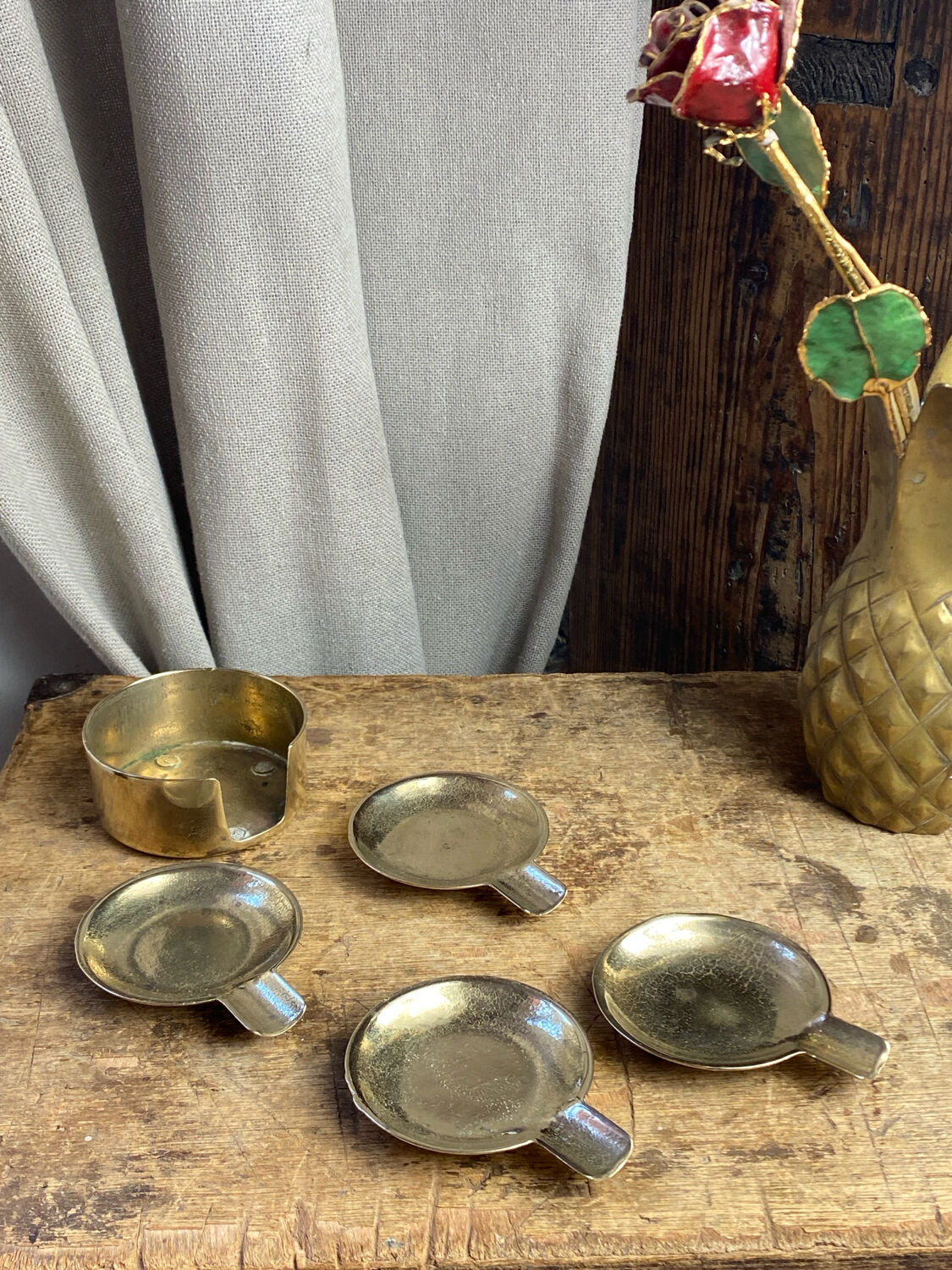 Individual brass ashtrays with storage support