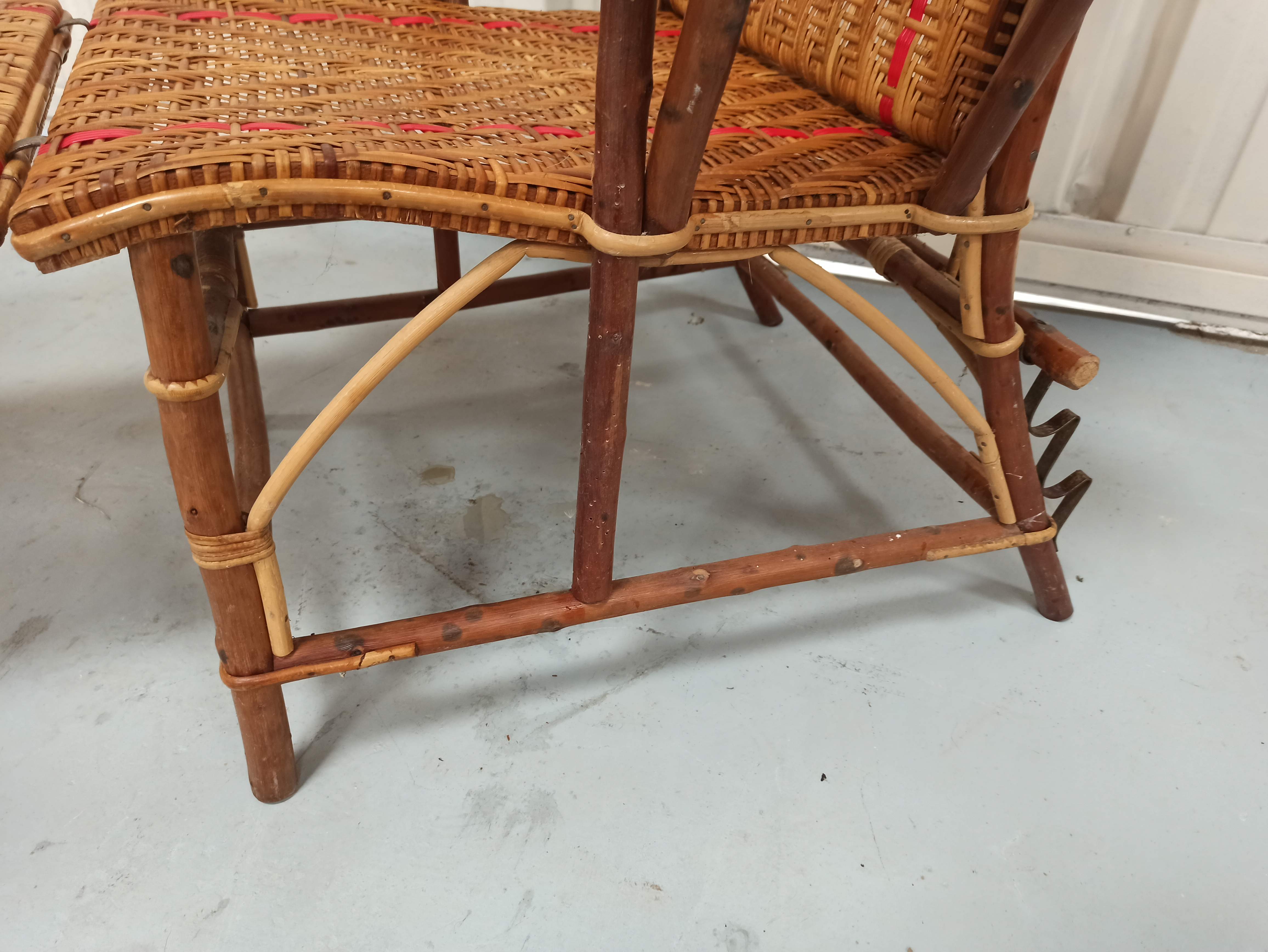Sunbathing sunbathing in wicker rattan wood deckchair red lounger