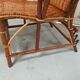 Sunbathing sunbathing in wicker rattan wood deckchair red lounger