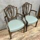 According to George Hepplewhite: pair of 19th century mahogany office armchairs