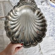 Large vintage shell-shaped platter in shiny silver-plated metal.