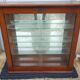 Vintage wood and glass shelf with mirror bottom