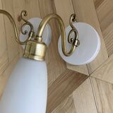 Pair of brass swan neck wall lights with white opaline glass tulip