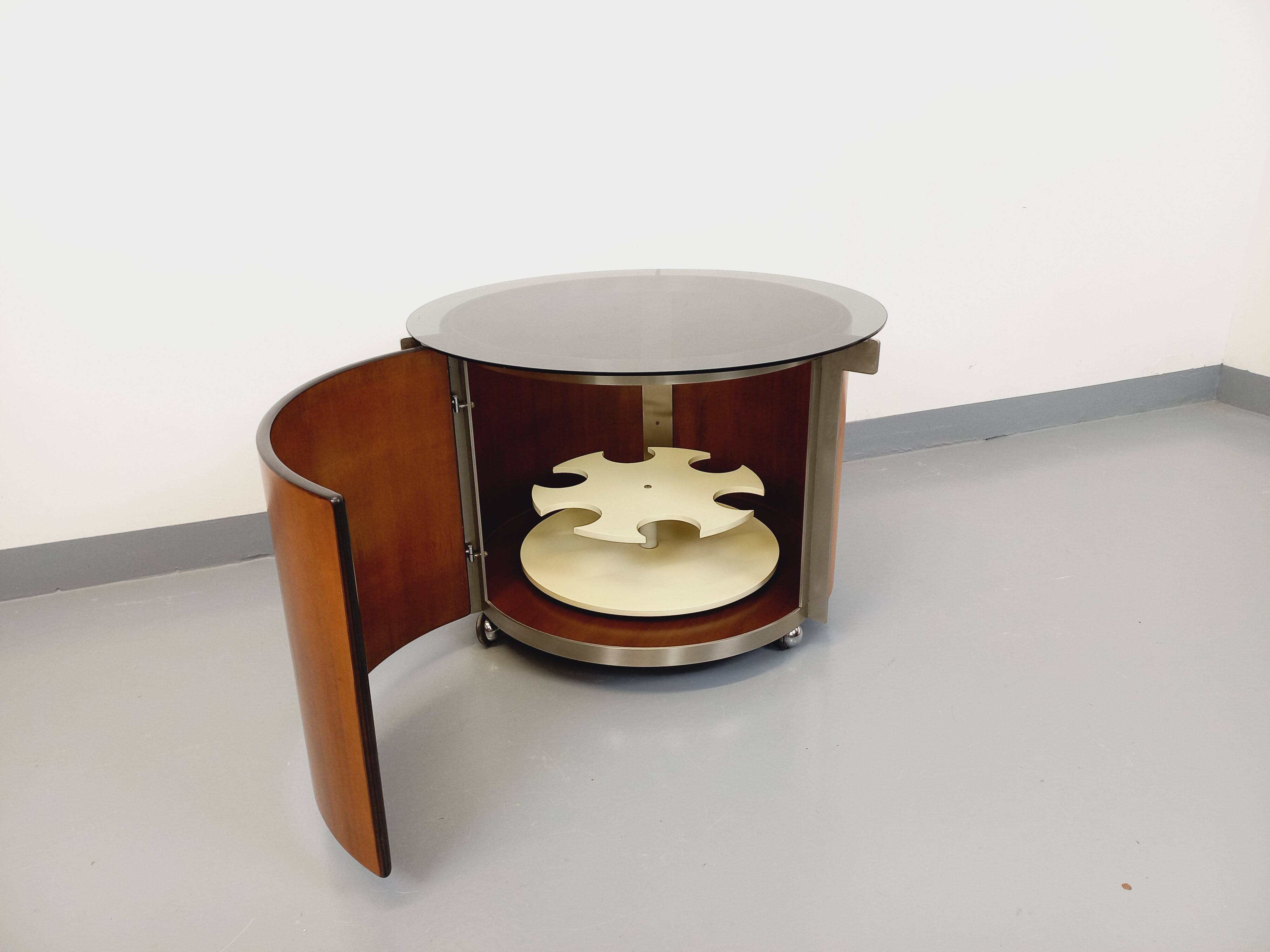 Round Italian teak coffee table swivel bar by Eugenio Gerli for Tecno