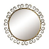Round mirror with golden metal arabesques