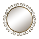 Round mirror with golden metal arabesques