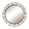 Round mirror with golden metal arabesques