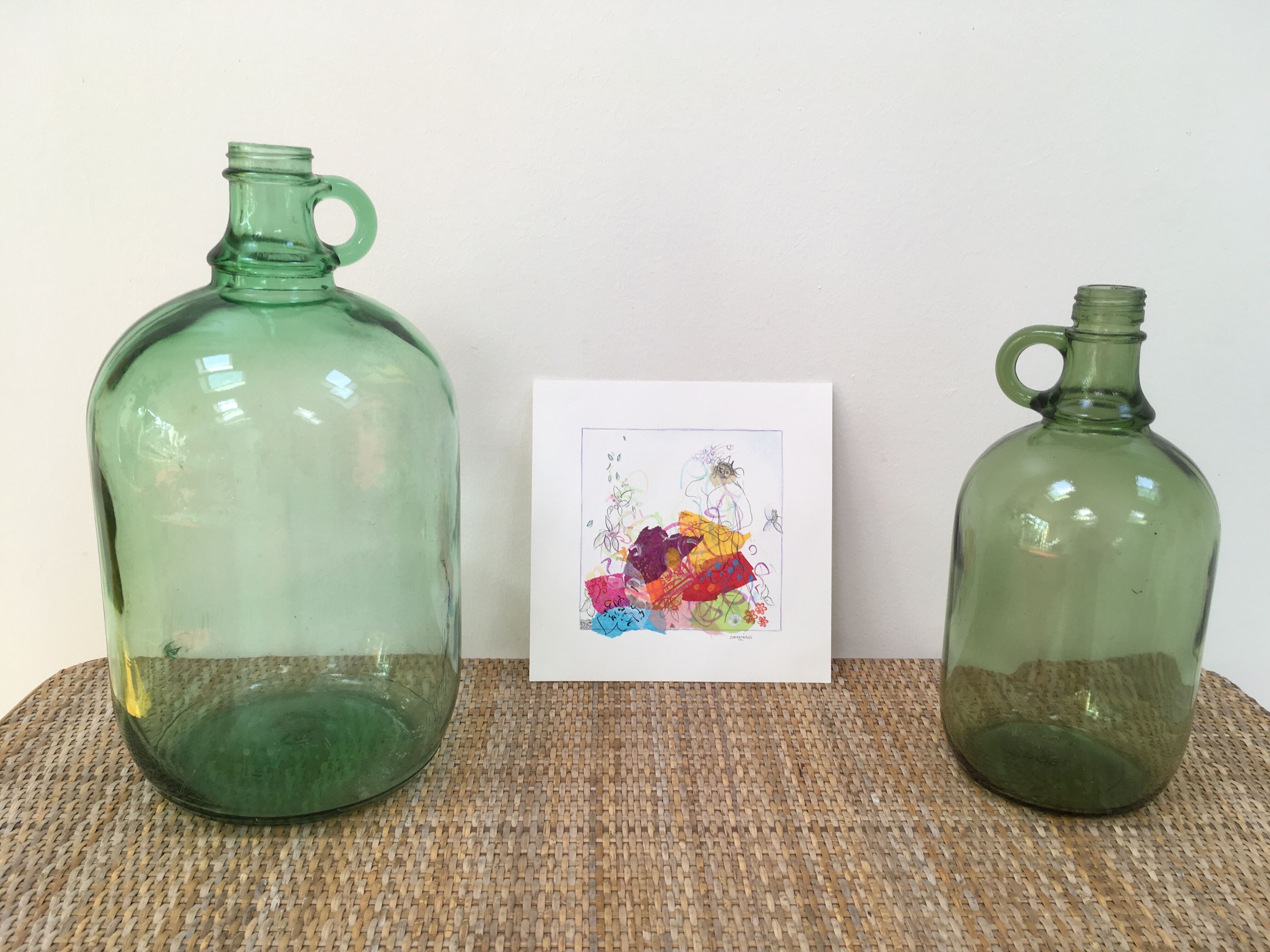 Pair of old demijohn bottles