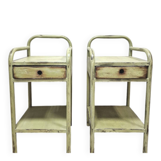 Copy of a pair of patinated metal bedside tables.