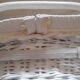 Wicker and painted wood baby cradle