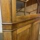 19th-century English corner cabinet in oak, mahogany, and fir.