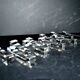 Set of 10 designer crystal knife rests, minimalist style