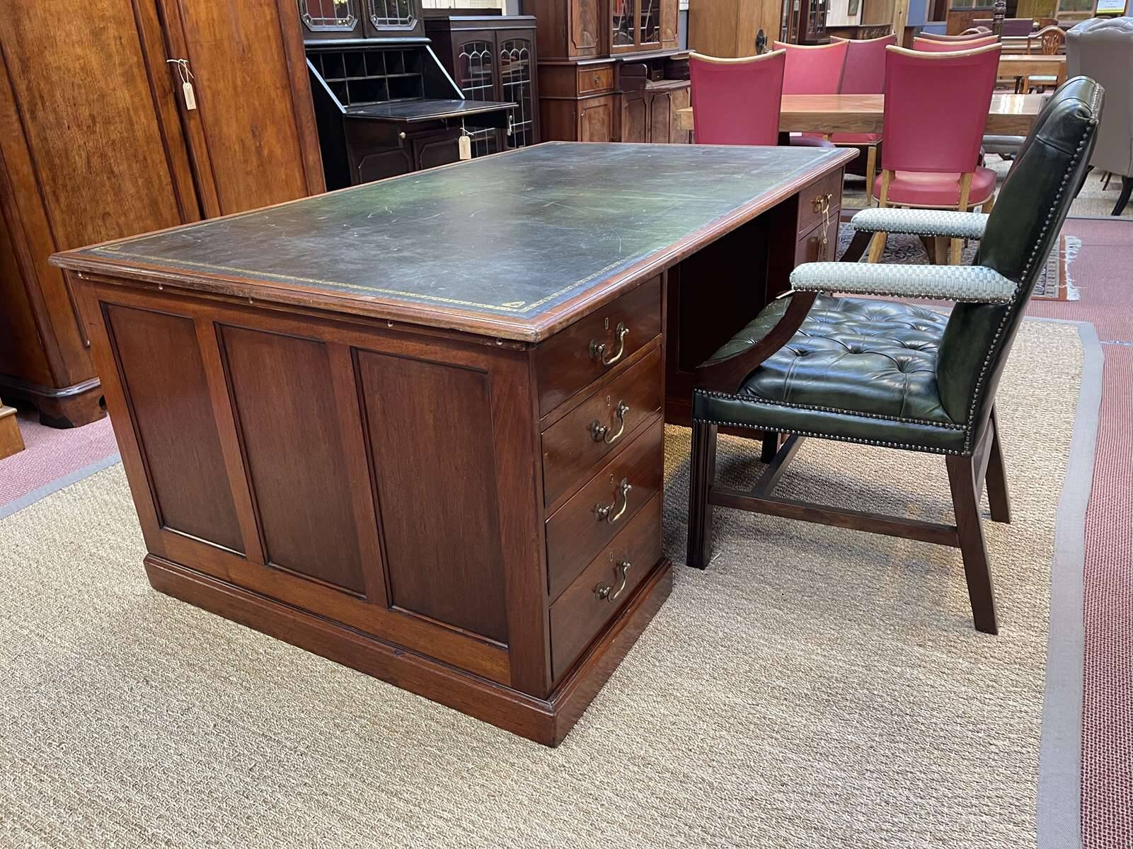 Large English flat desk in mahogany with leather top, early 20th century