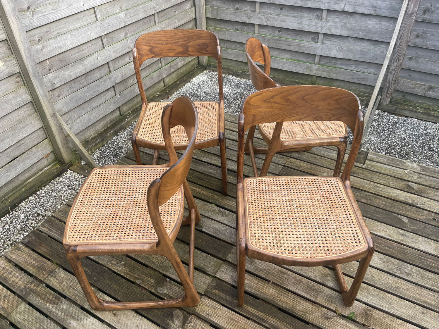 4 magnificent Baumann sled chairs, with caning.