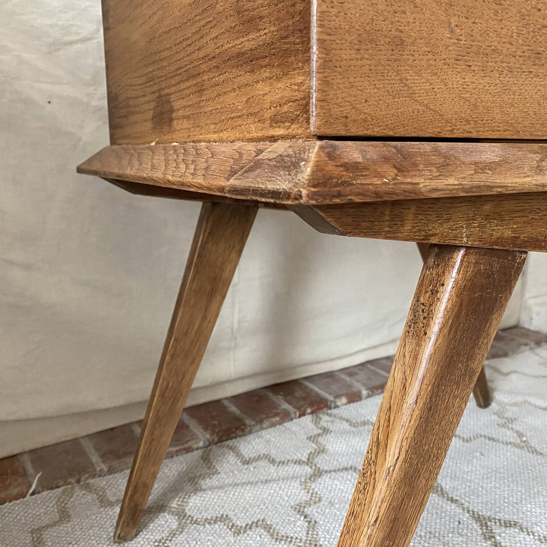 Scandinavian style bedside table with tapered legs from the 1960s.