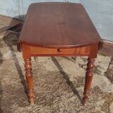 Old extendable round table in fruit wood with folding sides