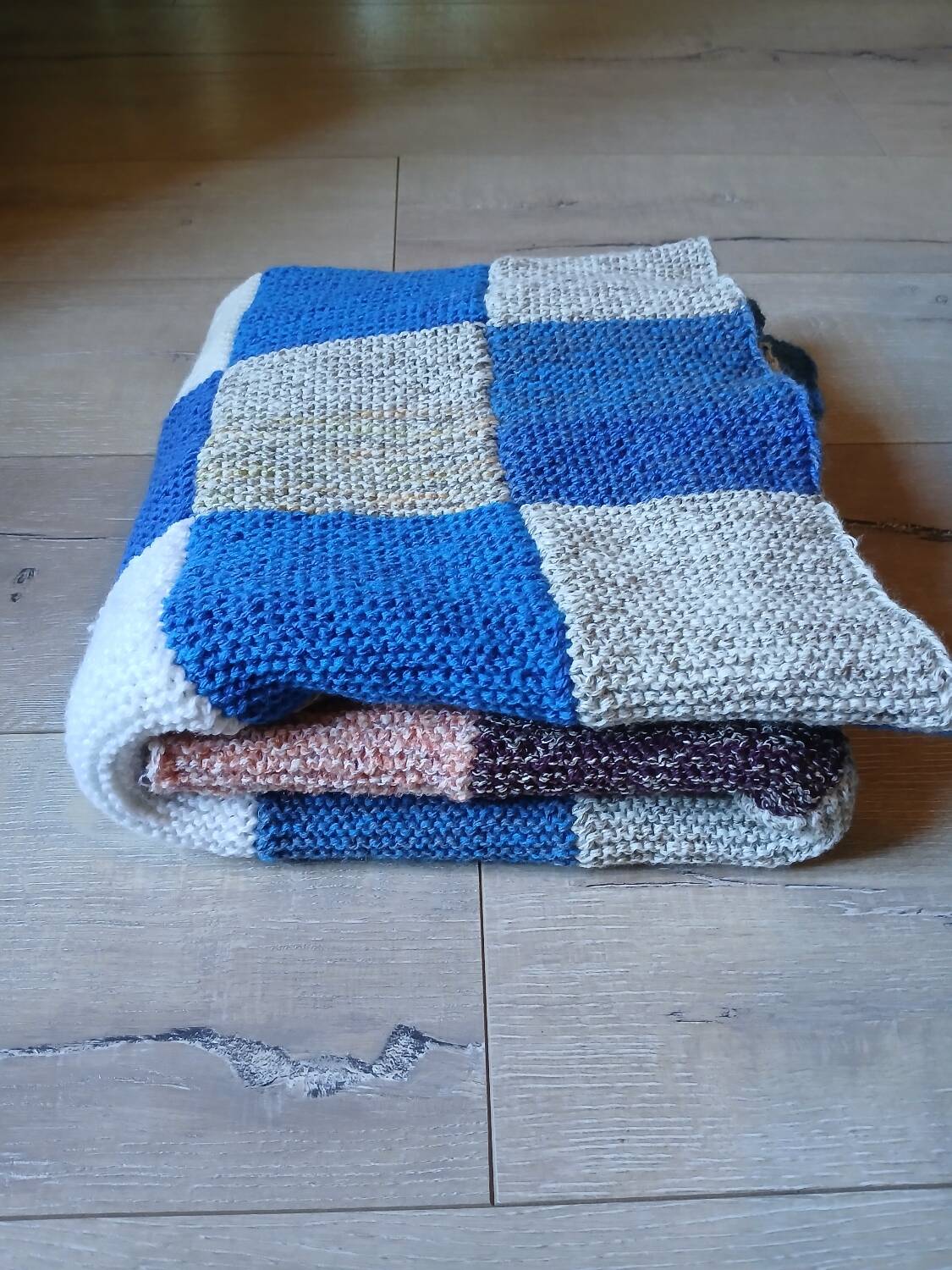 Hand knitted patchwork plaid