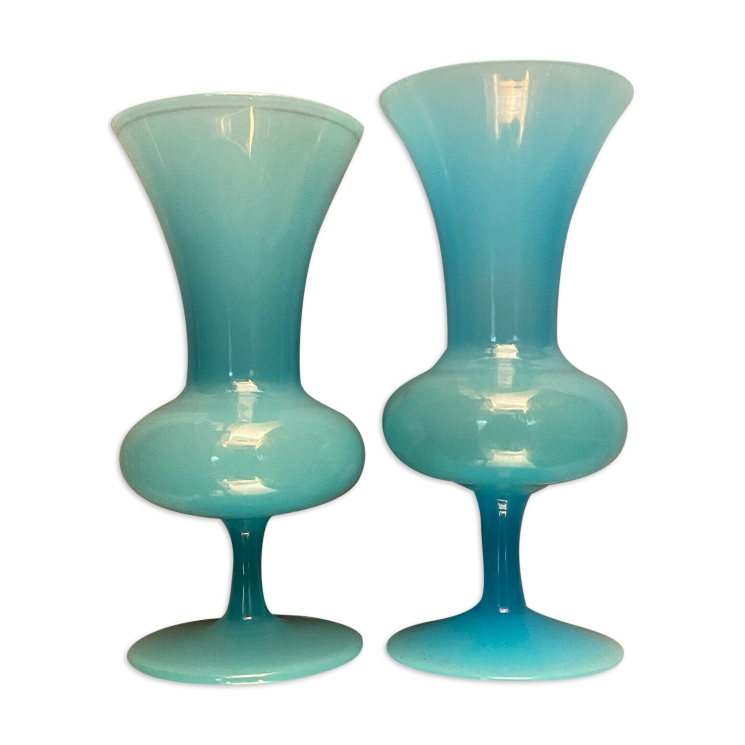 Two vases on a pedestal in blue opaline