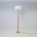 Mid-century floor lamp in brass and oak by Falkenbergs Belysning, Sweden, 1960s.