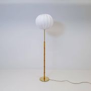 Mid-century floor lamp in brass and oak by Falkenbergs Belysning, Sweden, 1960s.