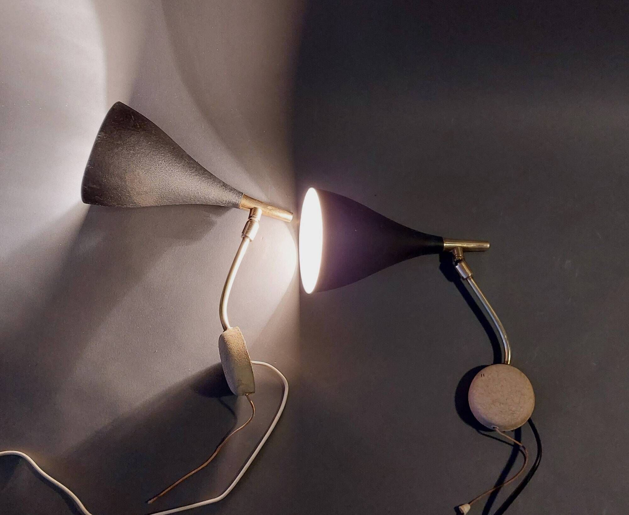 Pair of bedroom sconces in gilded brass and black aluminum 1960.