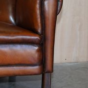 Victorian Chesterfield leather canapé with oak lion claw feet.