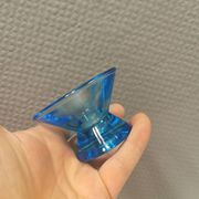 Two small candle holders in blue glass from the well-known Finnish company Ittala.