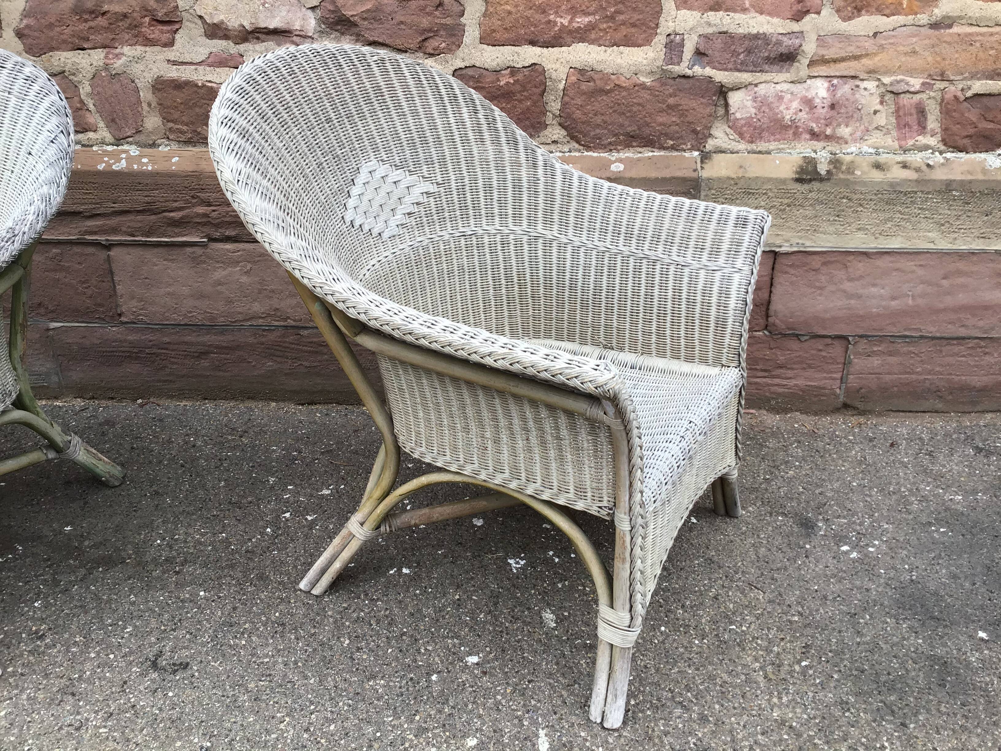 2 vintage grey rattan armchairs from the 60s